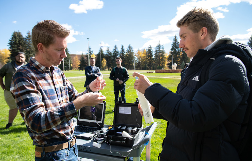 Professor and student work on weather research on Prexys Pasture