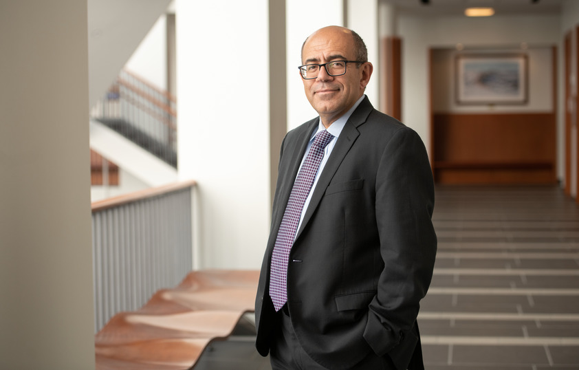 Professor posing for picture in the College of Business