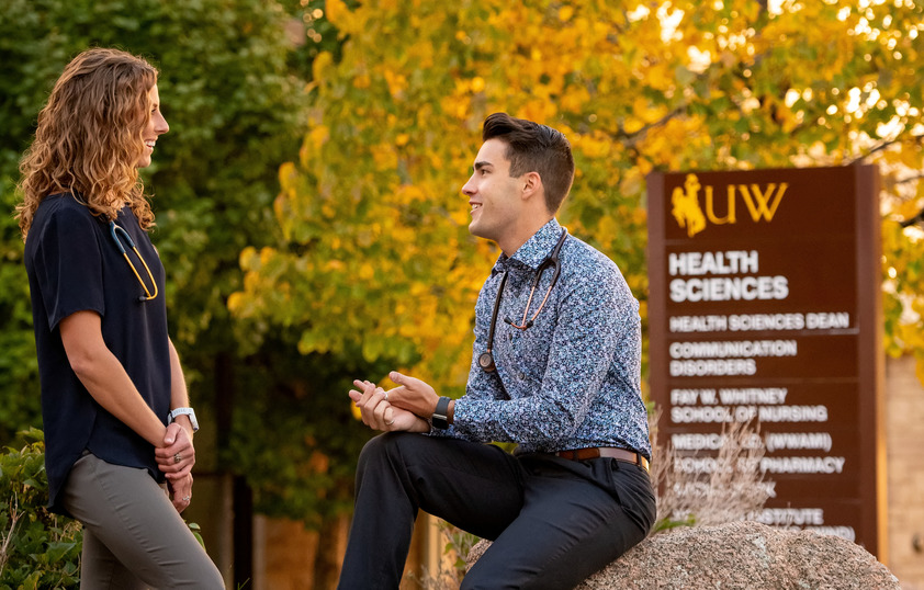 Students talking outside the College of Health Sciences