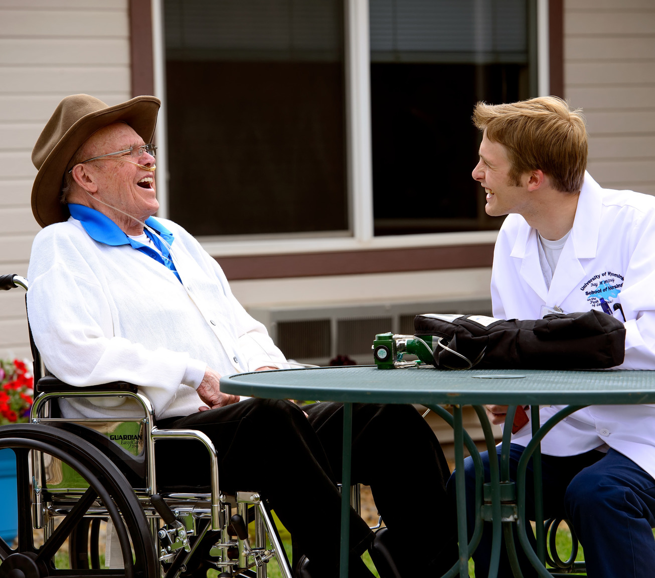 Nursing student with client laughing together