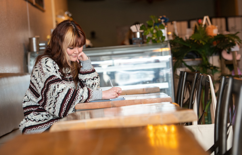 Student working at coffee shop