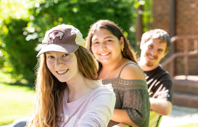 Three students posing for picture