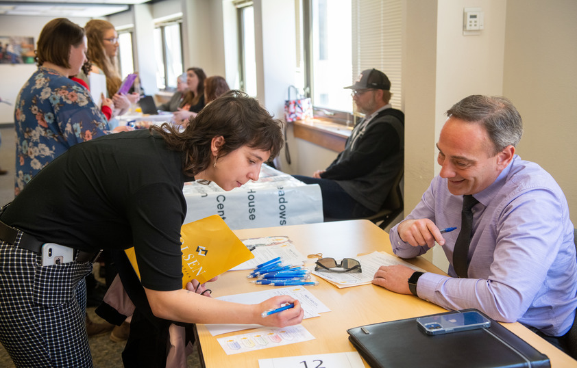 Student talking to vendor at career fair