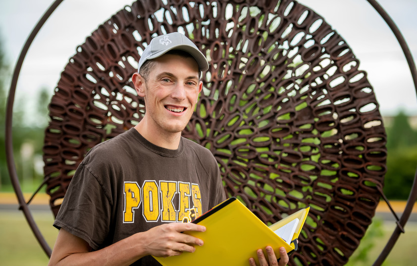 Student posing on campus