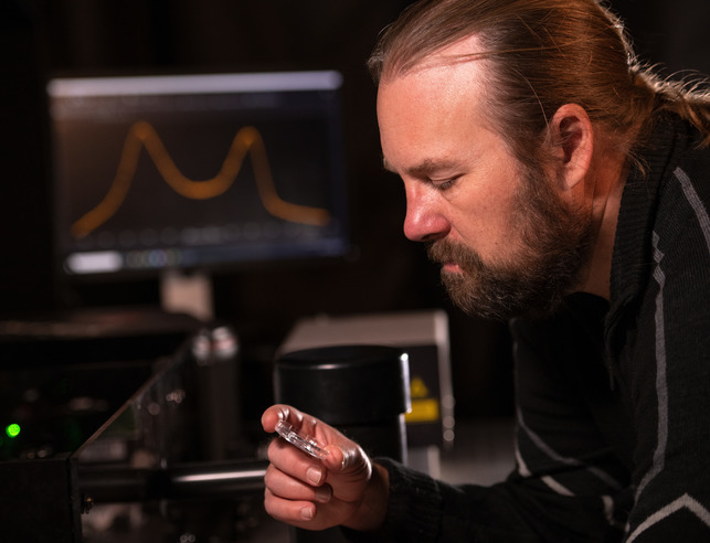 Chemical engineer examines a sample