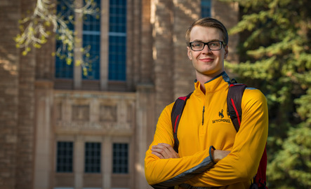 Student standing outside UW building