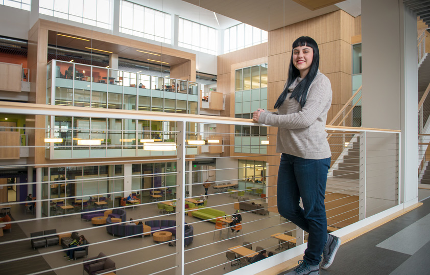 Student posing for photo in the Enzi STEM Building on UW's campus