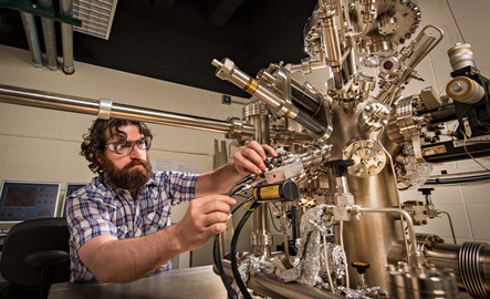 UW Chemist working with lab equipment