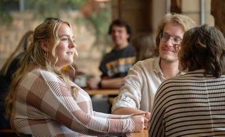 Students talking at a cafe
