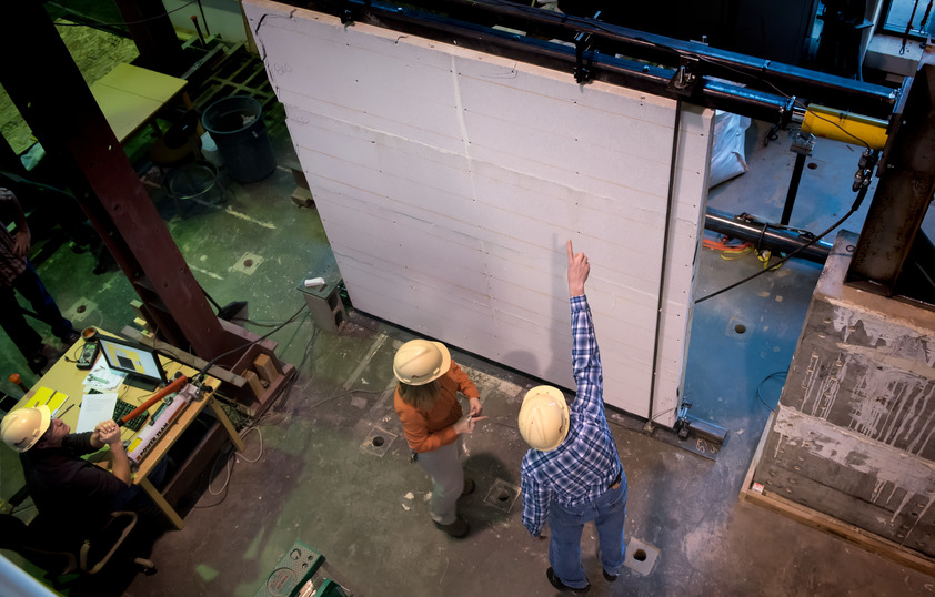 People with hard hats in a lab