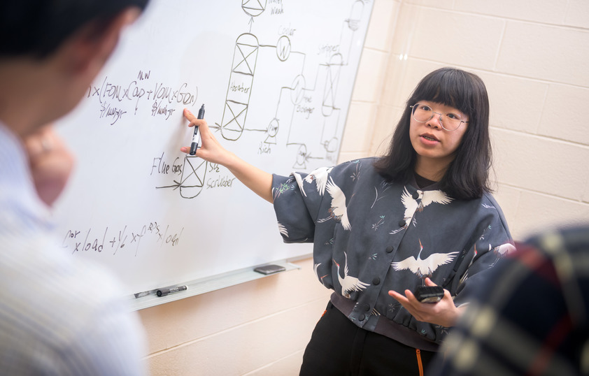 Student at white board