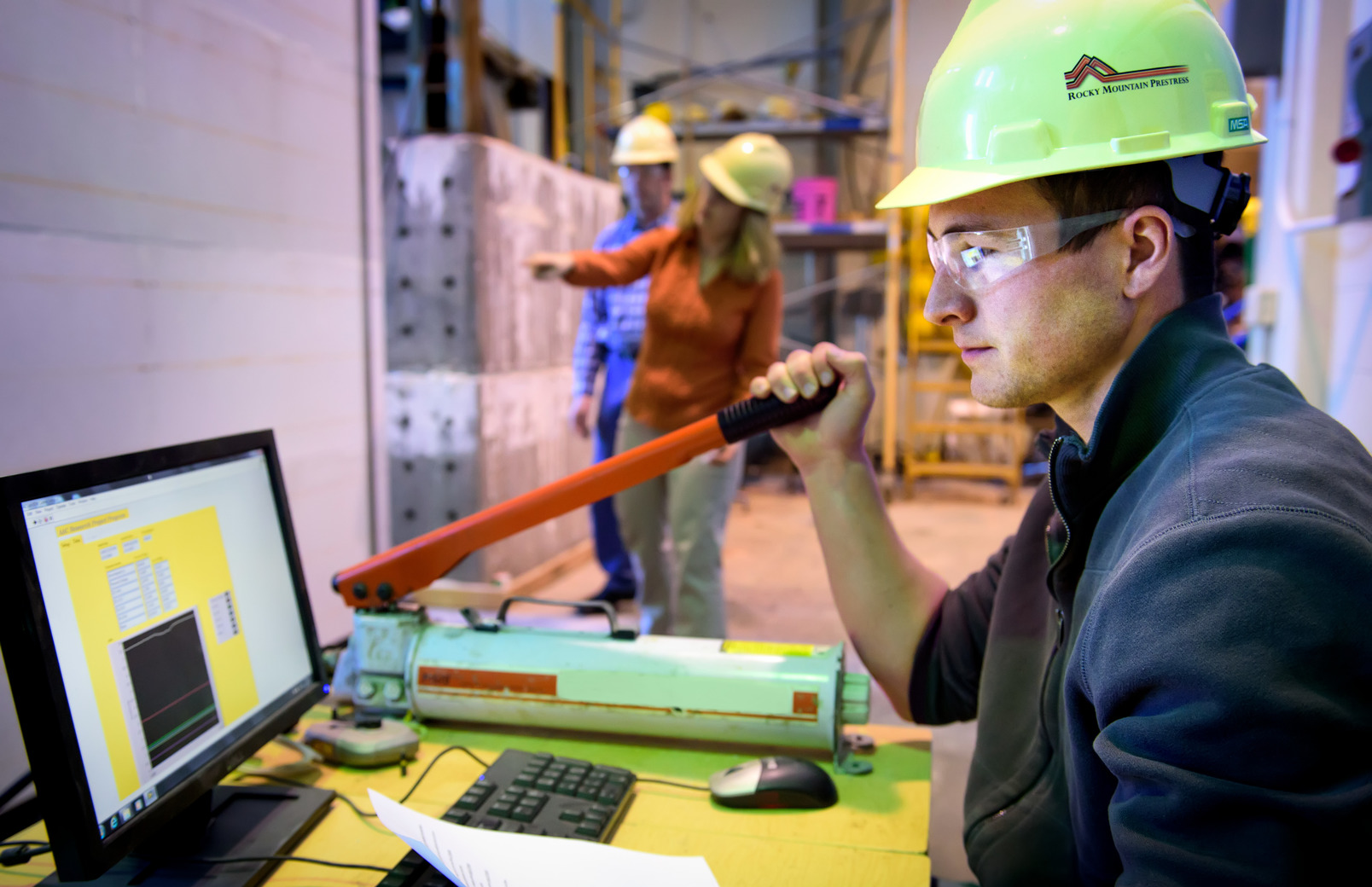 Construction worker working at computer