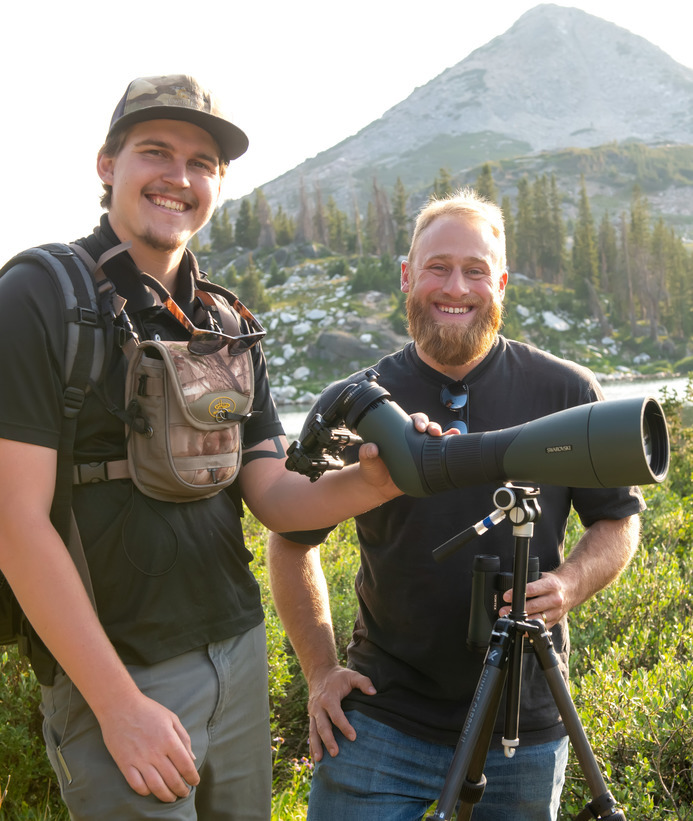 Two researchers smiling for the camera