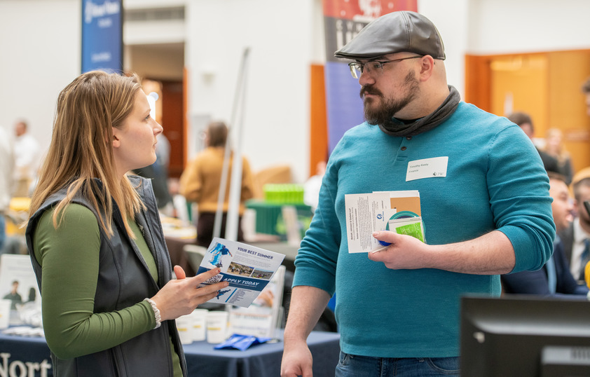 Student talking to vendor at Career Fair