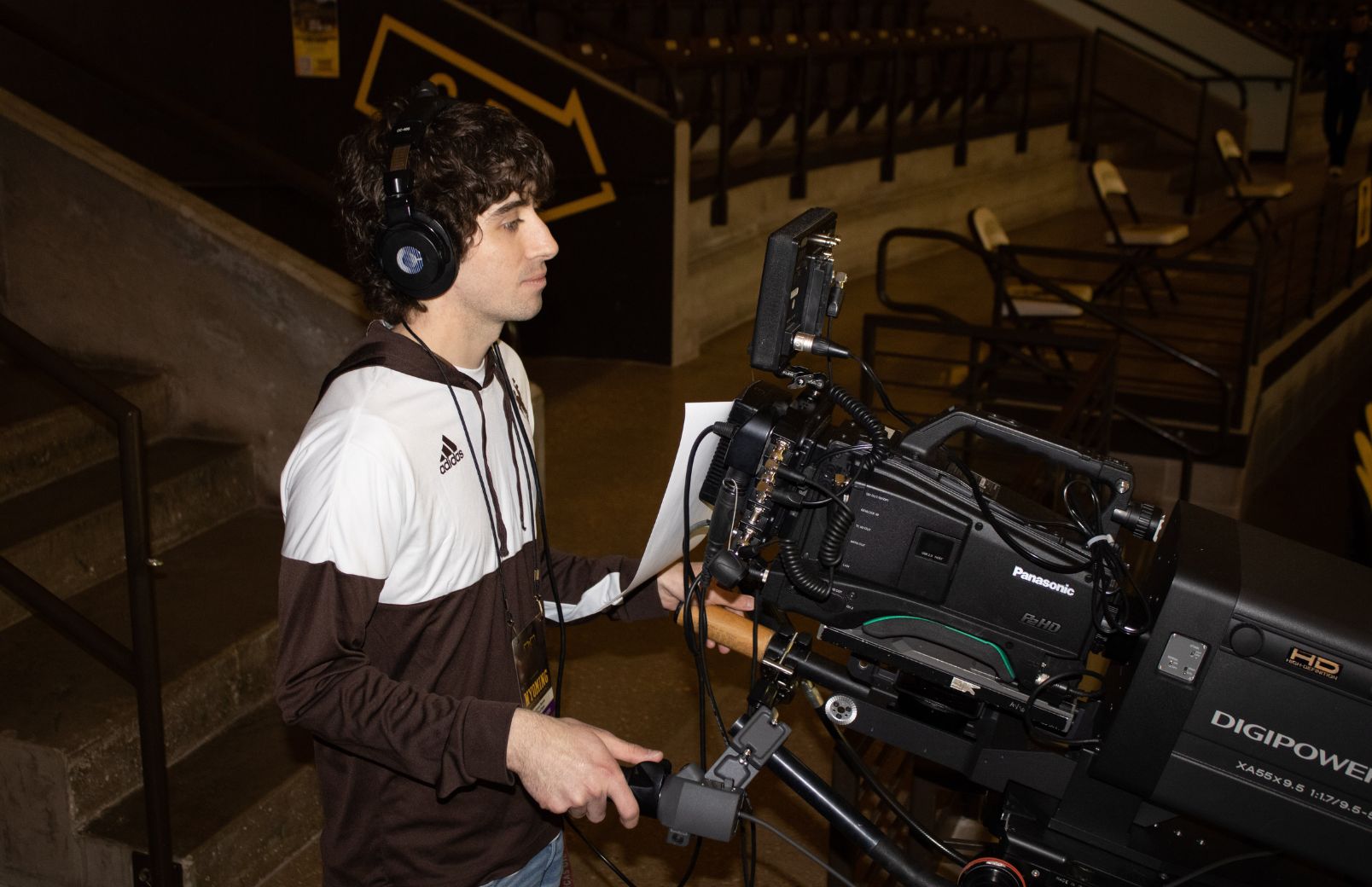 Student on camera at basketball game