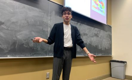 G.A. helping students in class