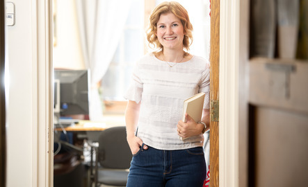 UW faculty member standing in their office