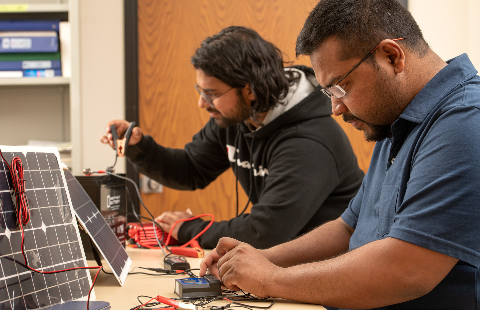 Two students working in a lab