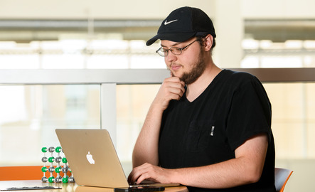 Computer science student on their laptop