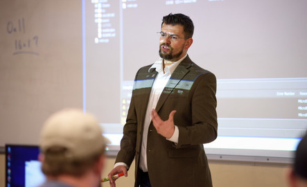 Professor teaching computer science class