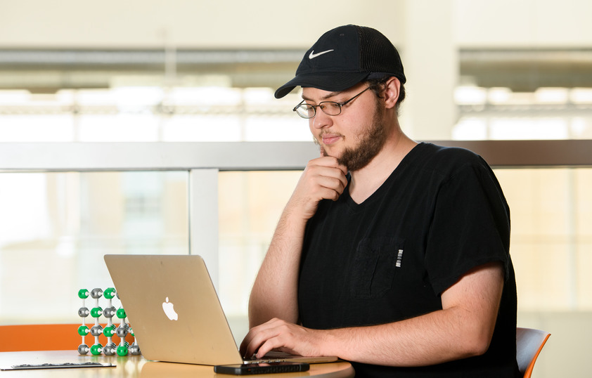 Student looking at laptop