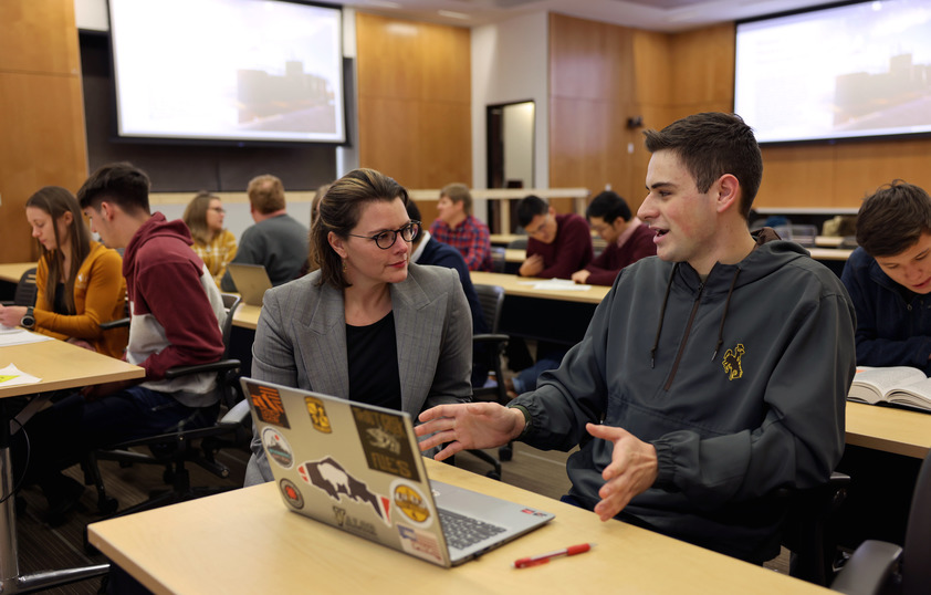 Professor and student working together in class