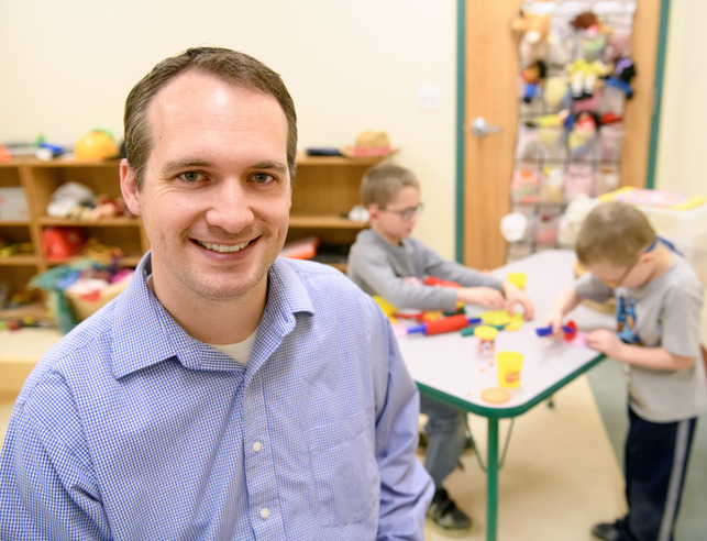 A counselor smiles for a photo
