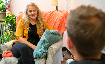 A counselor smiles at a client