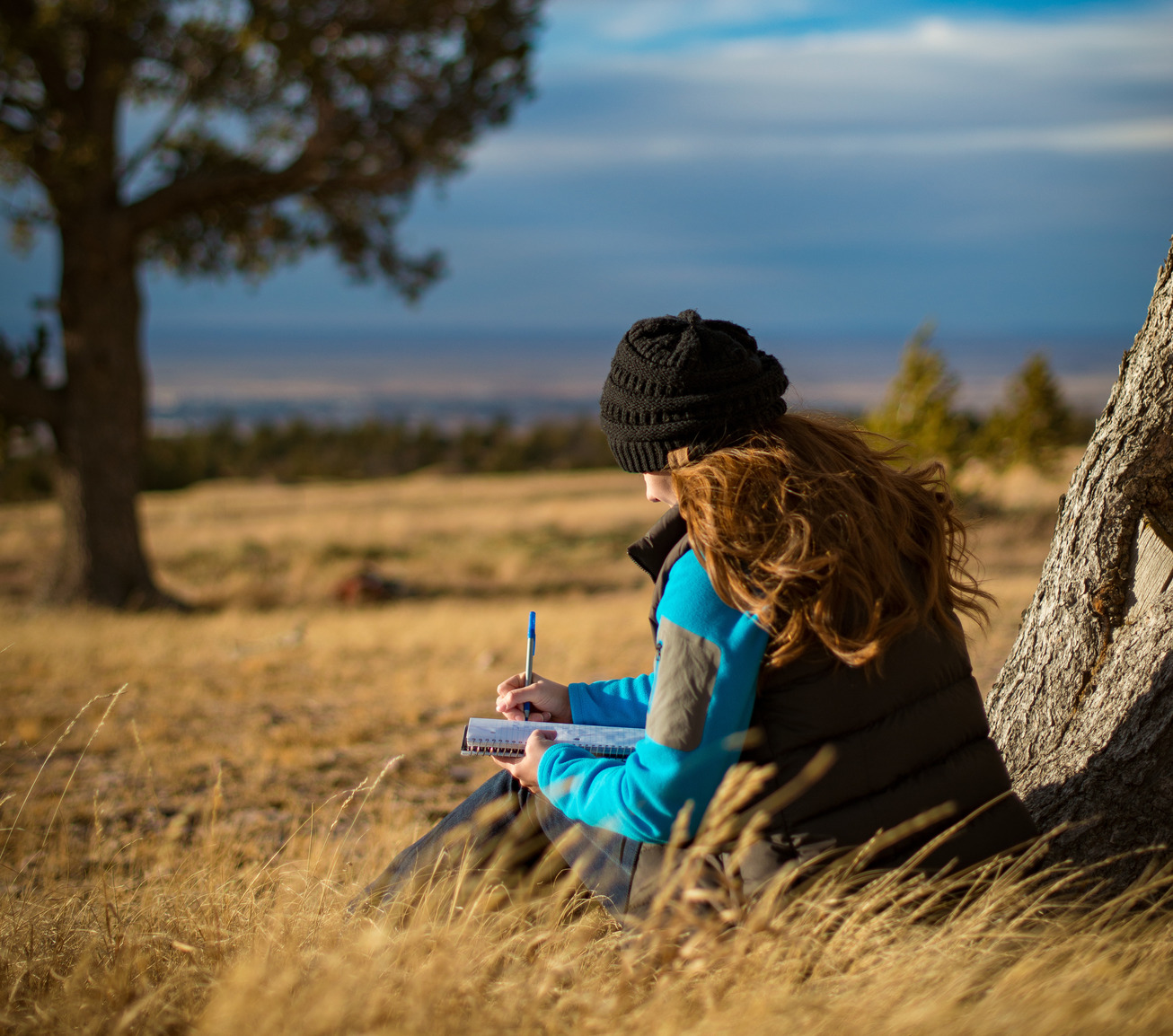 Student writing in the field