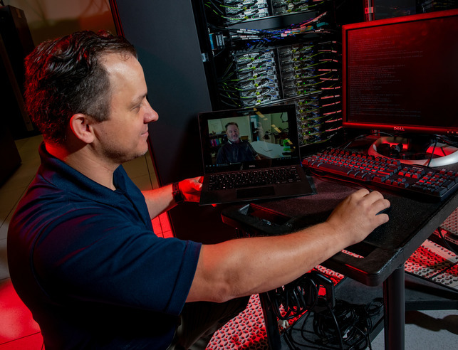 Person working on a large computer