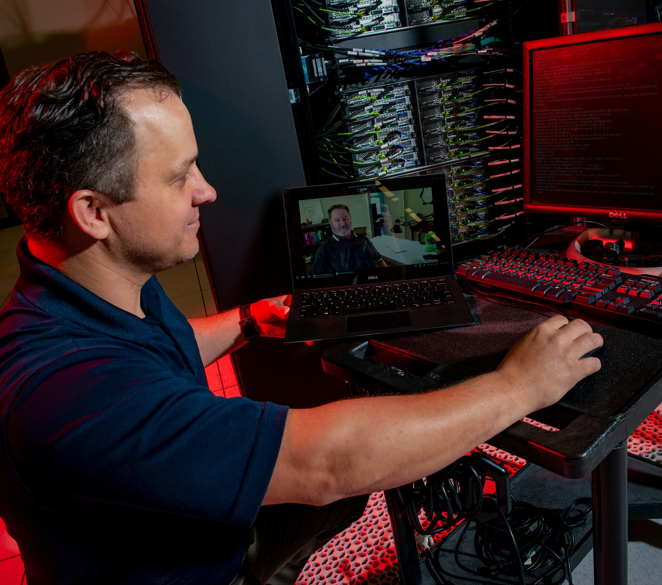 Person working on a large computer
