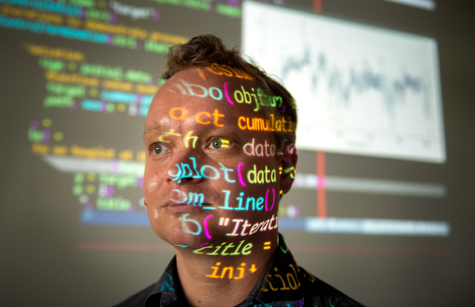 Person in front of projector screen