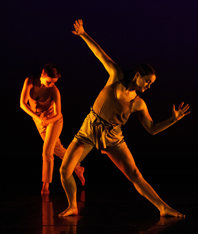 Two students perform a dance