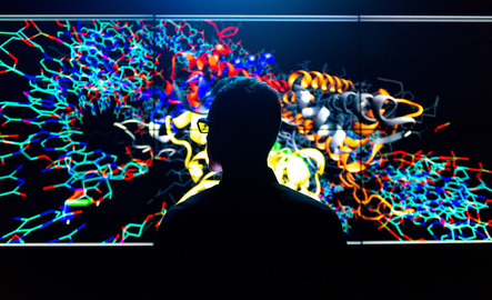 Student looking at large colorful photo