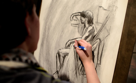 Student drawing in class