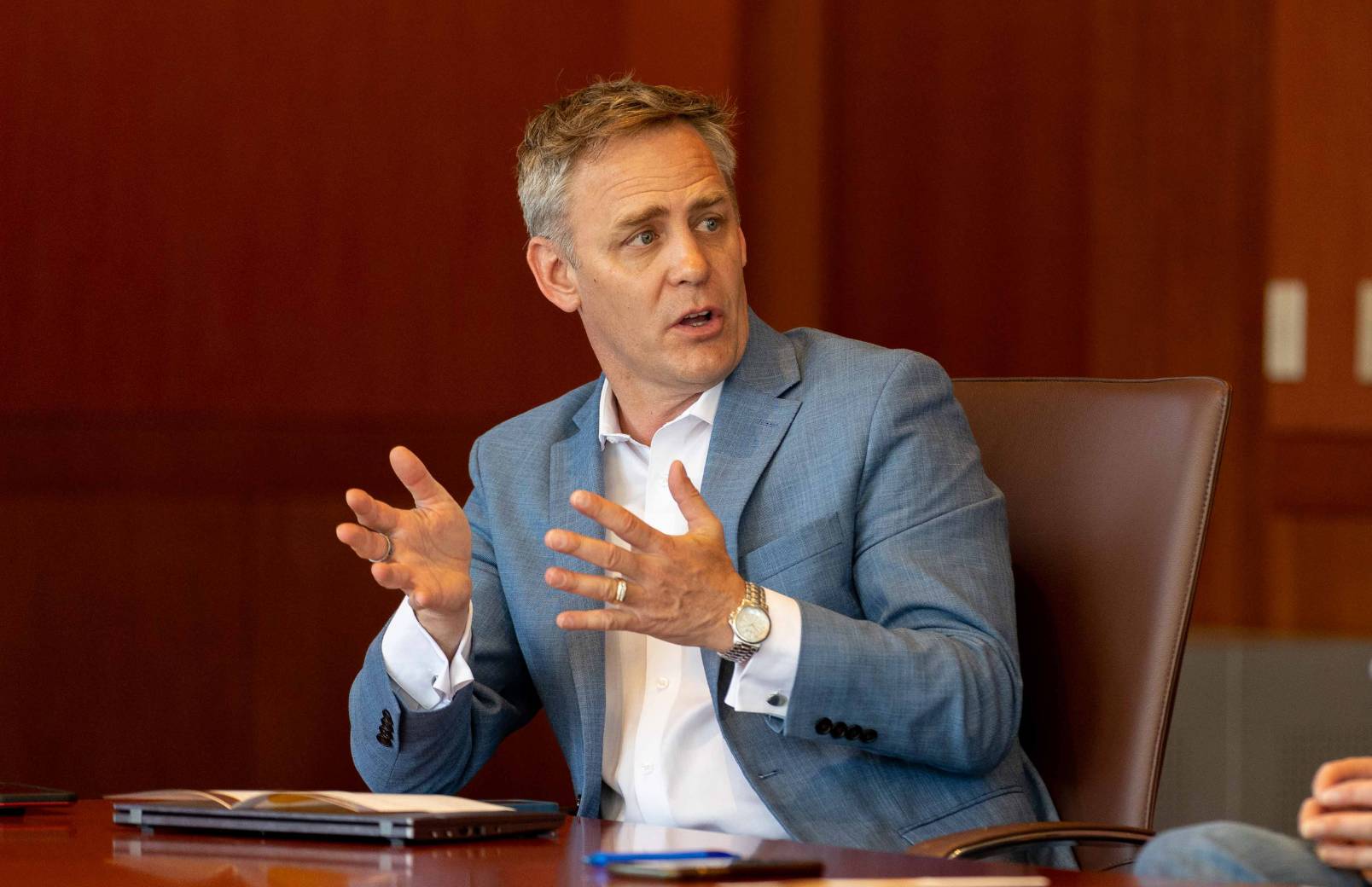 An economist talks during a meeting