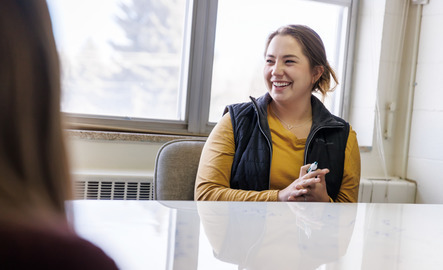 A business student smiles during class