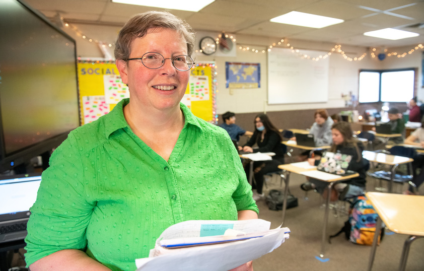 Principal posing in classroom