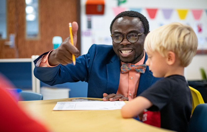 Teacher working with student