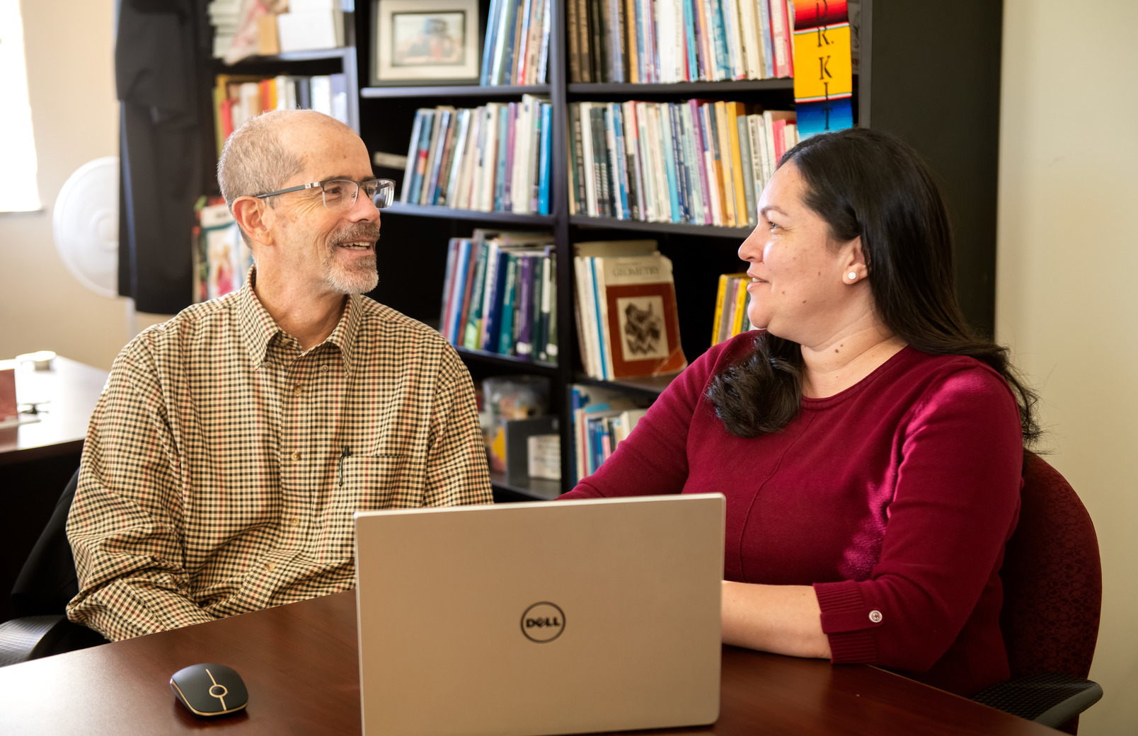 Two colleagues sitting at desk