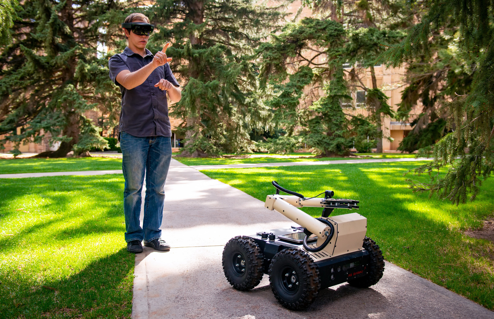 Bradley Riotto controls an electronic car through VR goggles.