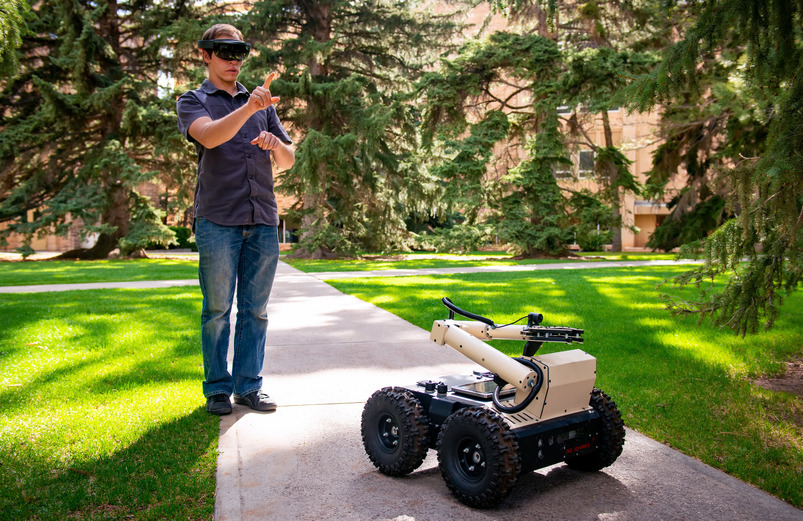 Bradley Riotto controls an electronic car through VR goggles