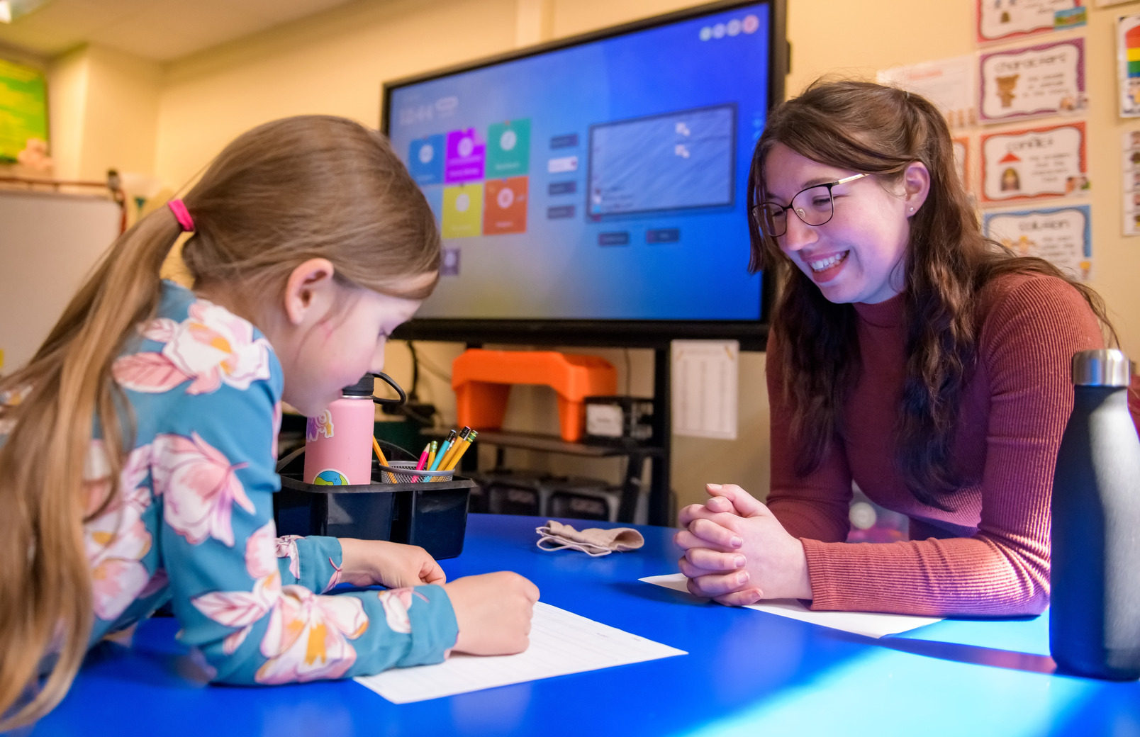 Teacher working with student