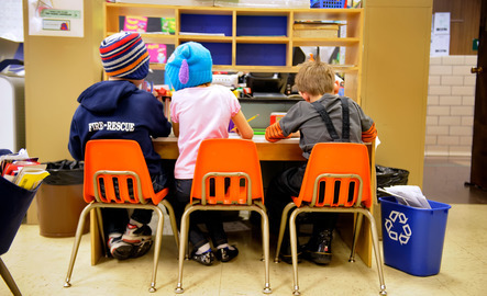 Elementary students sitting at a table
