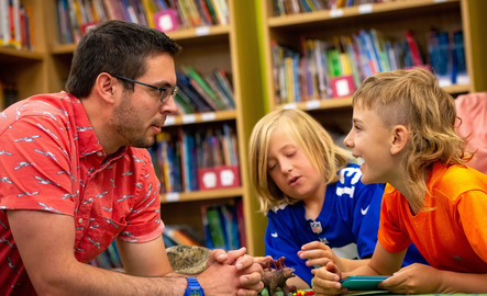 Teacher talking with elementary students