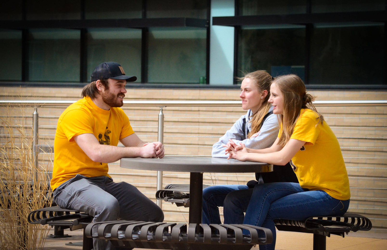 Students sitting at picnic table