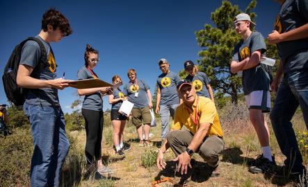 A professor and students out in the field
