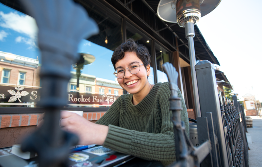 Student outside of coffee shop