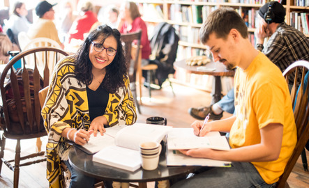 Students working on English coursework at a local coffee shop