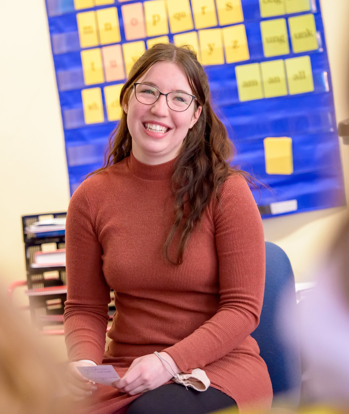 Teacher teaching in front of classroom